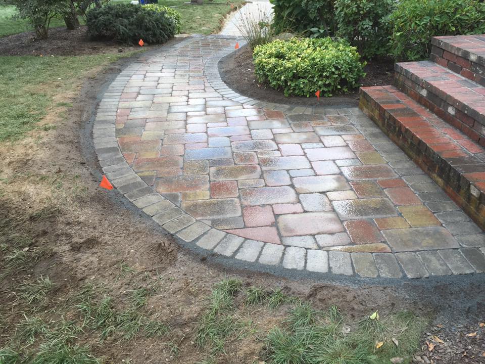 Custom outdoor fire pit and kitchen installation for outdoor entertaining in Northern RI